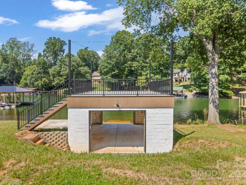 172 Honeydew Circle, Troutman, NC 28166.  MLS# CAR4277562, YatesRealty ID 29570. Boat House just feet from the water for easy lake amenities - Let your friend put their boat in AT YOUR HOUSE!