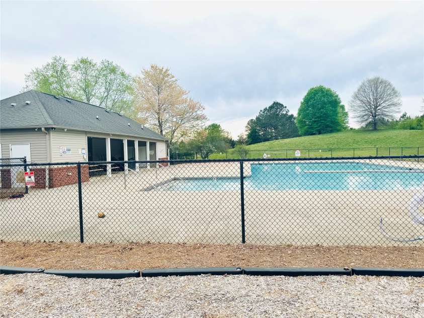 5821 Crestlawn Court, Pfafftown, NC 27040.  MLS# CAR4230431, YatesRealty ID 29574. Subdivision swimming pool