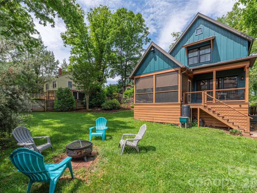 5 Grove Street, Weaverville, NC 28787.  MLS# CAR4381525, YatesRealty ID 29576. Fire pit in back yard