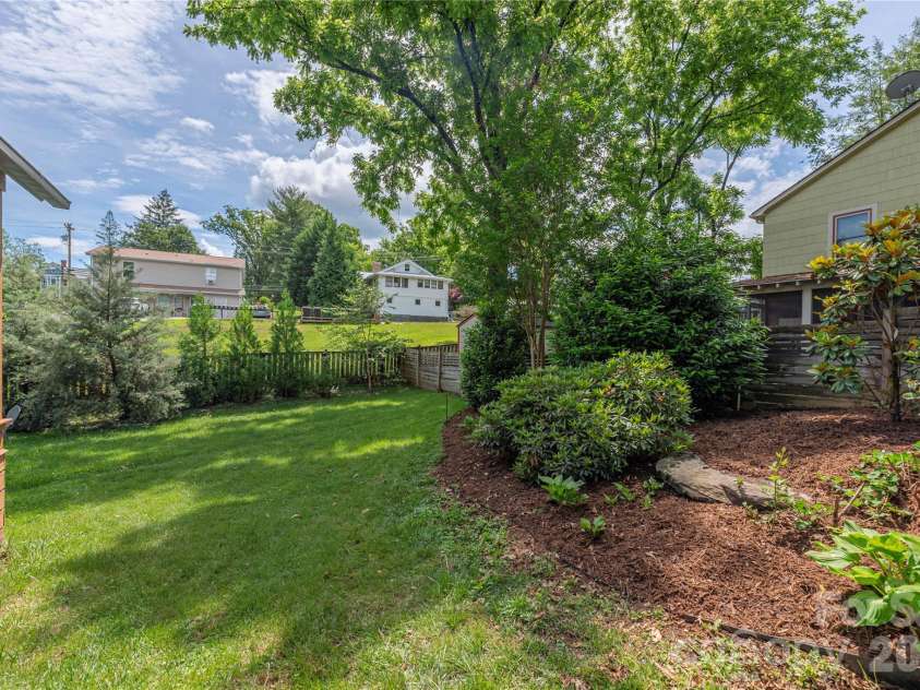 5 Grove Street, Weaverville, NC 28787.  MLS# CAR4381525, YatesRealty ID 29576. Side Yard