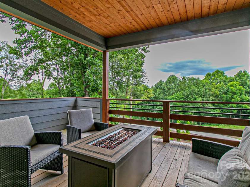 22 Lara Drive, Mills River, NC 28759.  MLS# CAR4271505, YatesRealty ID 2958. Side Covered Deck