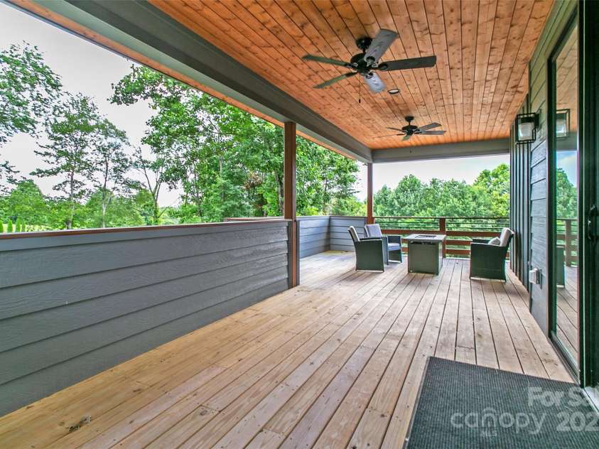 22 Lara Drive, Mills River, NC 28759.  MLS# CAR4271505, YatesRealty ID 2958. Side Covered Deck with Gas Firepit