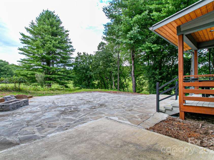 22 Lara Drive, Mills River, NC 28759.  MLS# CAR4271505, YatesRealty ID 2958. Steps to back patio and firepit