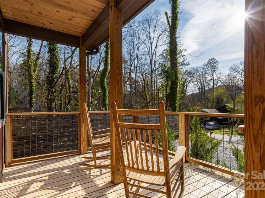 704 Azalea Avenue, Black Mountain, NC 28711.  MLS# CAR4283661, YatesRealty ID 29588. Front porch great for rocking chairs