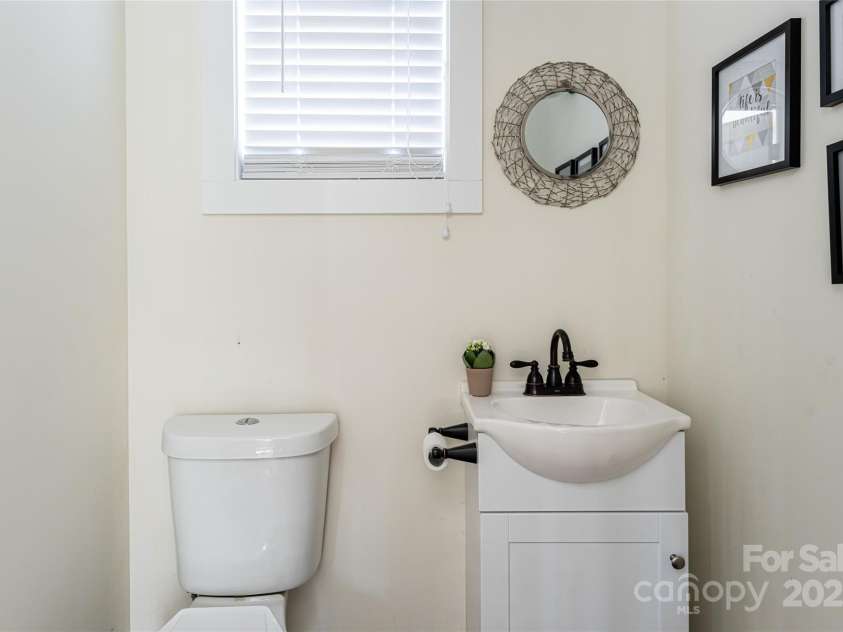 704 Azalea Avenue, Black Mountain, NC 28711.  MLS# CAR4283661, YatesRealty ID 29588. Main level half bath