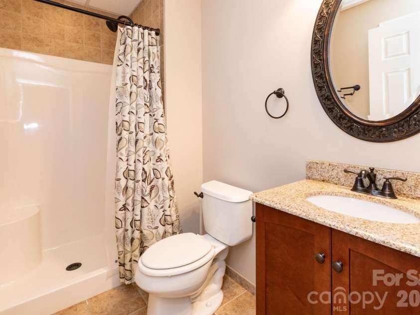 44 Deer Meadows Drive, Candler, NC 28715.  MLS# CAR4373513, YatesRealty ID 29593. Downstairs Bathroom
