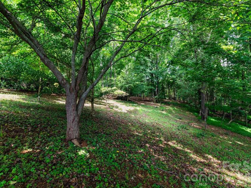 44 Deer Meadows Drive, Candler, NC 28715.  MLS# CAR4373513, YatesRealty ID 29593. Shaded Back Yard