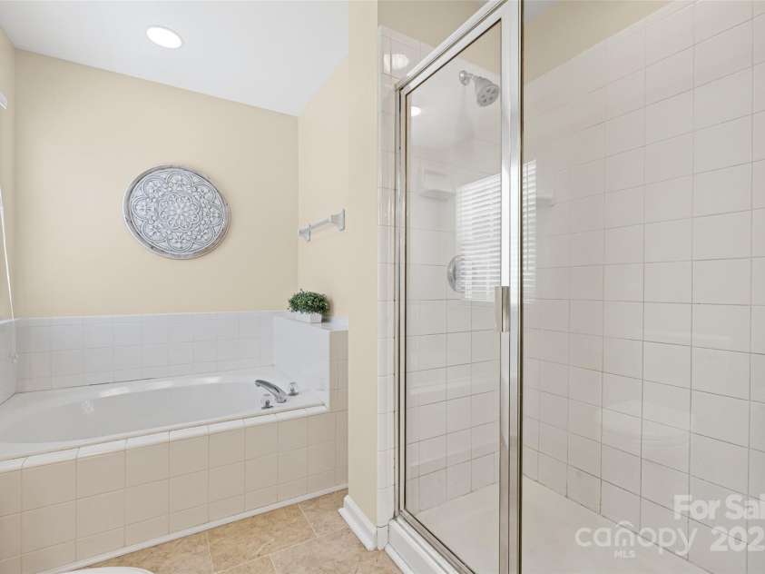 11621 Withers Mill Drive, Charlotte, NC 28278.  MLS# CAR4286202, YatesRealty ID 29594. Soak your cares away!  Walk-in shower too!
