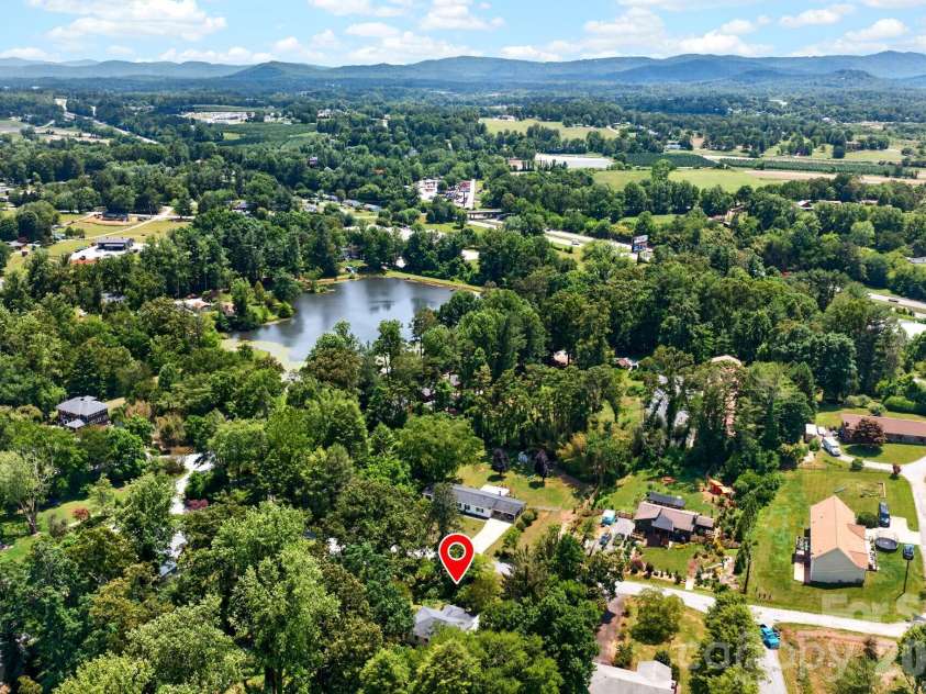 411 Hillcrest Circle, Hendersonville, NC 28792.  MLS# CAR4379885, YatesRealty ID 29595. Location with Lake