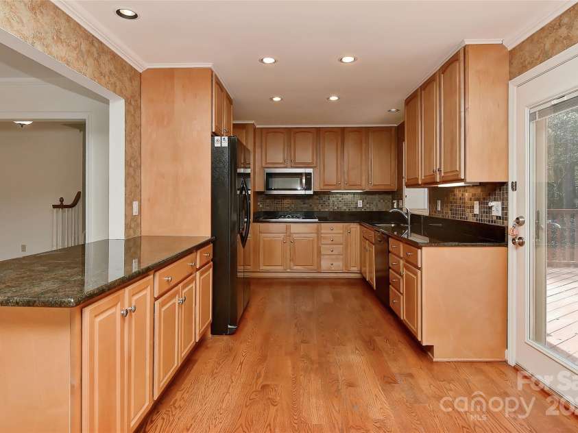 6117 Yellowood Road, Charlotte, NC 28210.  MLS# CAR4272398, YatesRealty ID 29599. Another view showing off real hardwood floors, custom cabinets and recessed lighting