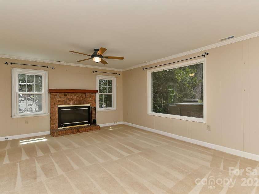 6117 Yellowood Road, Charlotte, NC 28210.  MLS# CAR4272398, YatesRealty ID 29599. Real wood burning fireplace on lower level in family room