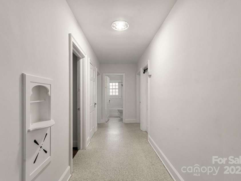 728 Blanton Street, Shelby, NC 28150.  MLS# CAR4274982, YatesRealty ID 29604. The hallway to the bedrooms  has a built-in display nook and you can see several gorgeous glass door knobs, both hallmarks of 1930s design.