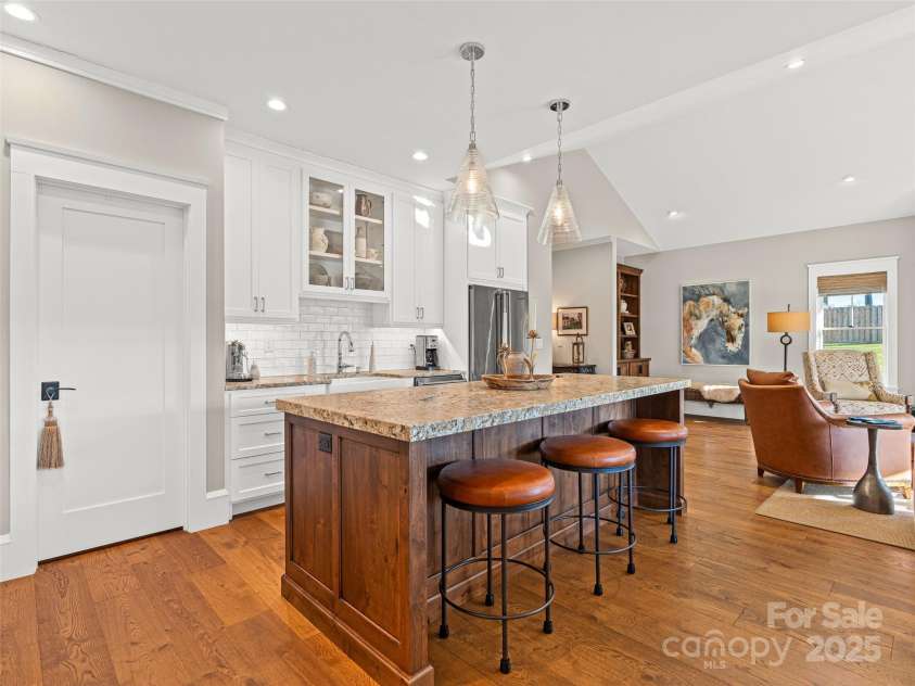 6 Starwood Valley Trail, Arden, NC 28704.  MLS# CAR4329581, YatesRealty ID 29605. The Leathered countertops give the island the high-end finish 