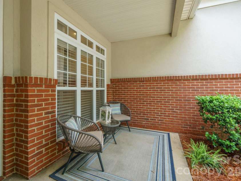 8829 Legacy Lake Lane, Charlotte, NC 28269.  MLS# CAR4385979, YatesRealty ID 29621. Front porch