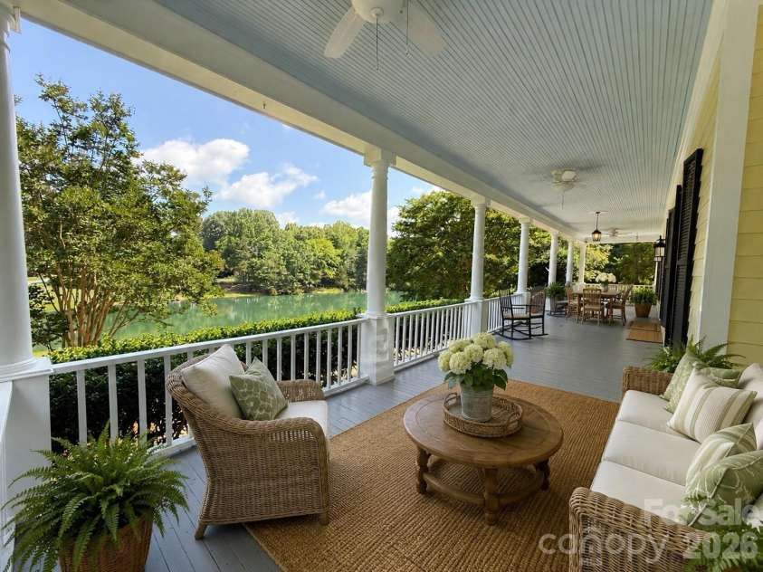 7902 Southerland Drive, Browns Summit, NC 27214.  MLS# CAR4372307, YatesRealty ID 29622. Front wrap around porch virtually staged