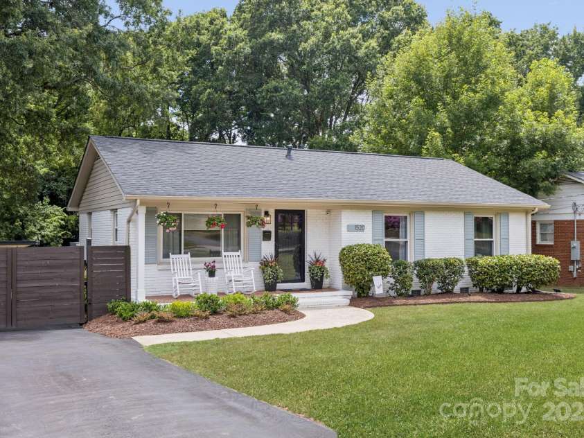 1520 Starbrook Drive, Charlotte, NC 28210.  MLS# CAR4274449, YatesRealty ID 29630. 1520 Starbrook Drive has a huge, flat lot complete with a repaved & resealed (May 2024) driveway leading to a private carport through the secure electric/keypad coded gate