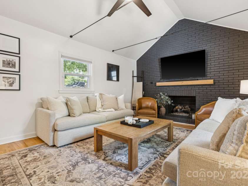 1520 Starbrook Drive, Charlotte, NC 28210.  MLS# CAR4274449, YatesRealty ID 29630. Cozy den with gorgeous cathedral ceilings + gas fireplace