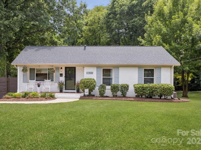 1520 Starbrook Drive, Charlotte, NC 28210.  MLS# CAR4274449, YatesRealty ID 29630. Huge, flat lot complete with a repaved & resealed (May 2024) driveway leading to a private carport through the secure electric/keypad coded gate. Full privacy fence in the backyard.