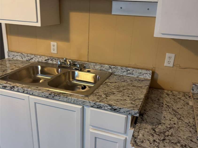 209 Rickenbacker Street, Lancaster, SC 29720.  MLS# CAR4392585, YatesRealty ID 29634. Kitchen, tenant provides oven and refrigerator