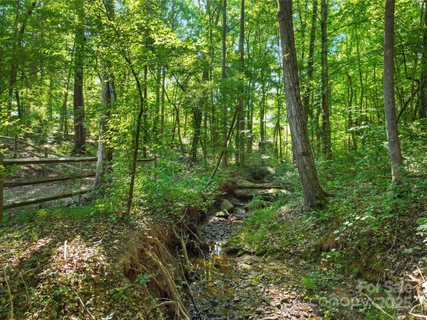 171 Shenandoah Loop, Troutman, NC 28166.  MLS# CAR4283740, YatesRealty ID 29636. Behind house