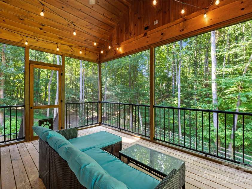 171 Shenandoah Loop, Troutman, NC 28166.  MLS# CAR4283740, YatesRealty ID 29636. Screened deck overlooks wooded area