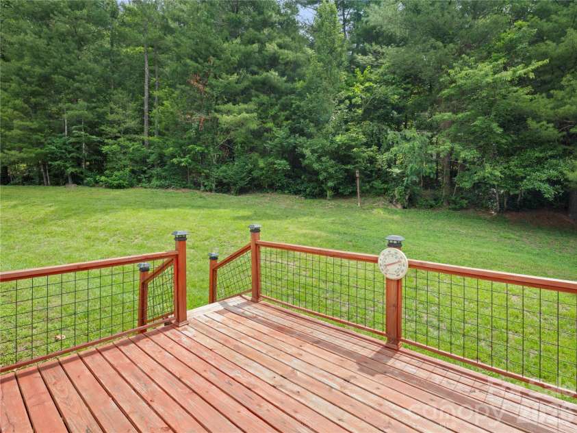 5 Harrison Hill Road, Swannanoa, NC 28778.  MLS# CAR4391617, YatesRealty ID 29644. Back deck overlooking large lush backyard, located on a corner lot