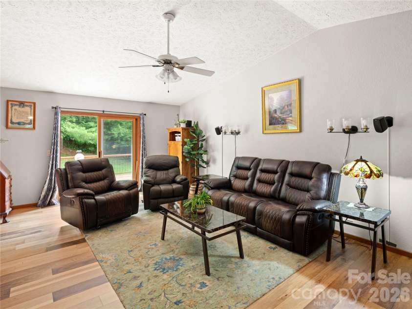 5 Harrison Hill Road, Swannanoa, NC 28778.  MLS# CAR4391617, YatesRealty ID 29644. Large living room with direct access to back deck