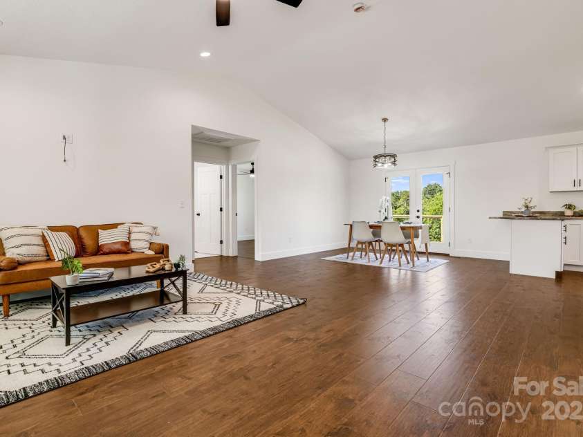 607 Silkwood Drive, Canton, NC 28716.  MLS# CAR4283110, YatesRealty ID 29645. Living area looking toward dining area