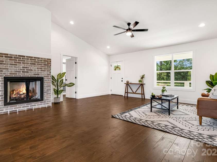 607 Silkwood Drive, Canton, NC 28716.  MLS# CAR4283110, YatesRealty ID 29645. Living area with gas log fireplace