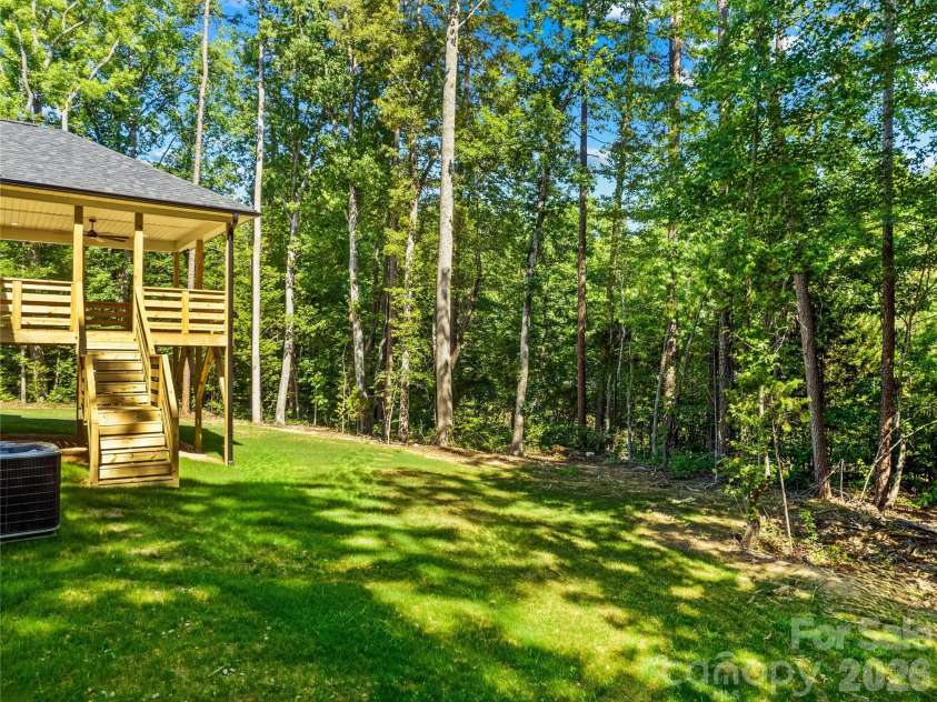 1065 Shawnee Trail, China Grove, NC 28023.  MLS# CAR4391383, YatesRealty ID 29651. Back yard is private. Shows without staging.