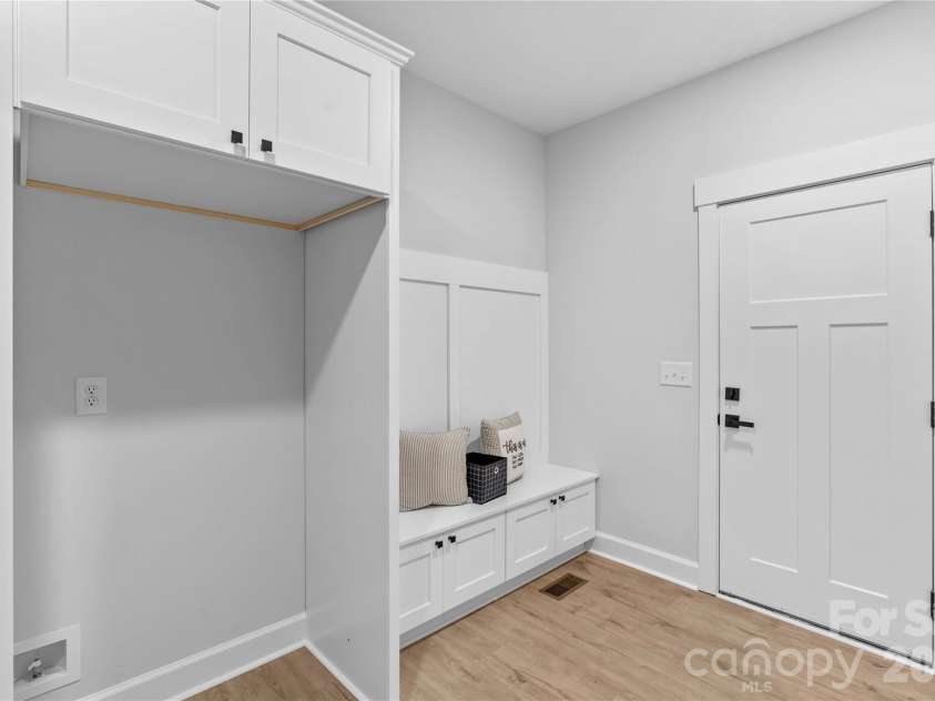 1065 Shawnee Trail, China Grove, NC 28023.  MLS# CAR4391383, YatesRealty ID 29651. Drop Zone Bench coming in from garage.