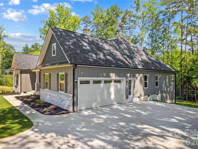 1065 Shawnee Trail, China Grove, NC 28023.  MLS# CAR4391383, YatesRealty ID 29651. Side load garage & door for access.