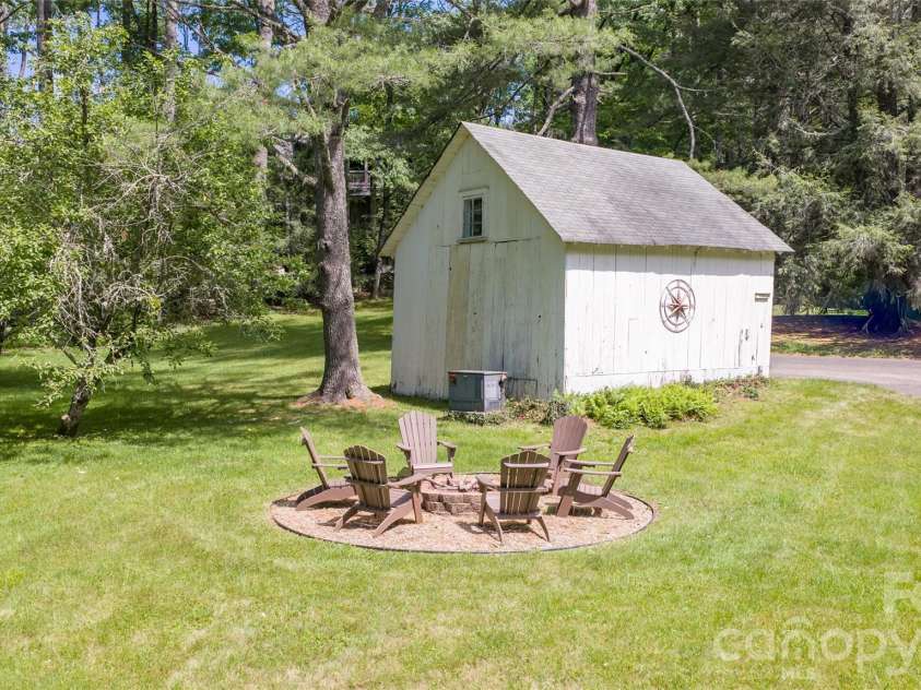 760 5th Street, Highlands, NC 28741.  MLS# CAR4390432, YatesRealty ID 29656. Barn and Fire Pit