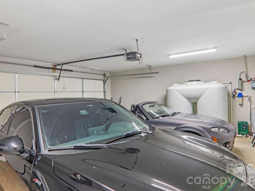 49 Wilderness Trail, Candler, NC 28715.  MLS# CAR4391801, YatesRealty ID 29657. 2 car garage lower level