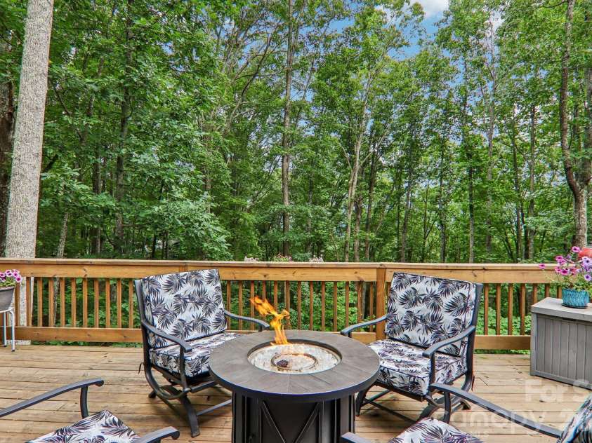 49 Wilderness Trail, Candler, NC 28715.  MLS# CAR4391801, YatesRealty ID 29657. Beautiful deck main level