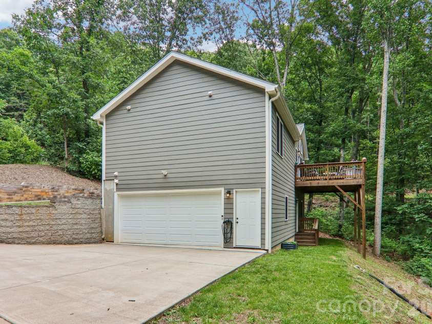 49 Wilderness Trail, Candler, NC 28715.  MLS# CAR4391801, YatesRealty ID 29657. Level parking adjoining garage