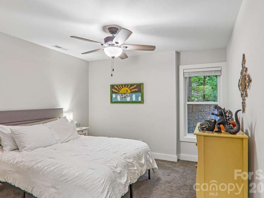 49 Wilderness Trail, Candler, NC 28715.  MLS# CAR4391801, YatesRealty ID 29657. Lower level bedroom