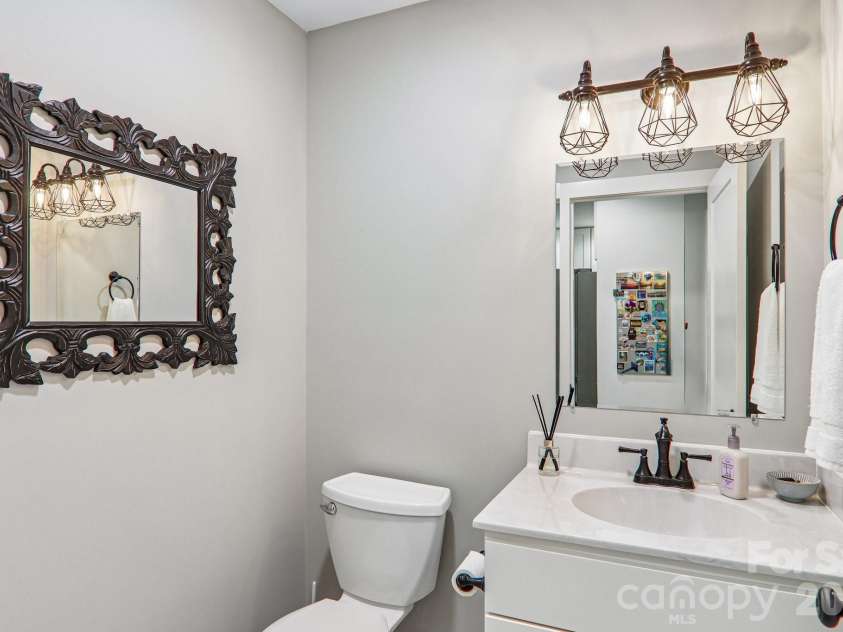 49 Wilderness Trail, Candler, NC 28715.  MLS# CAR4391801, YatesRealty ID 29657. Main level half bath