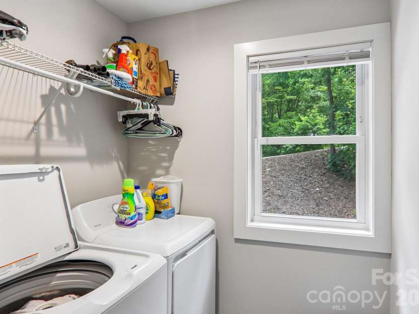 49 Wilderness Trail, Candler, NC 28715.  MLS# CAR4391801, YatesRealty ID 29657. Main level laundry room