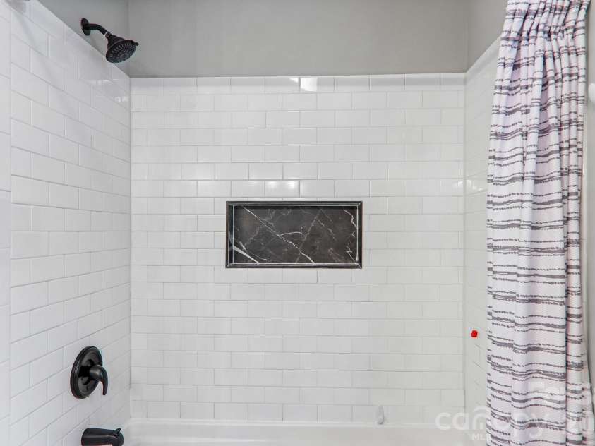 49 Wilderness Trail, Candler, NC 28715.  MLS# CAR4391801, YatesRealty ID 29657. Owner's suite bathroom
