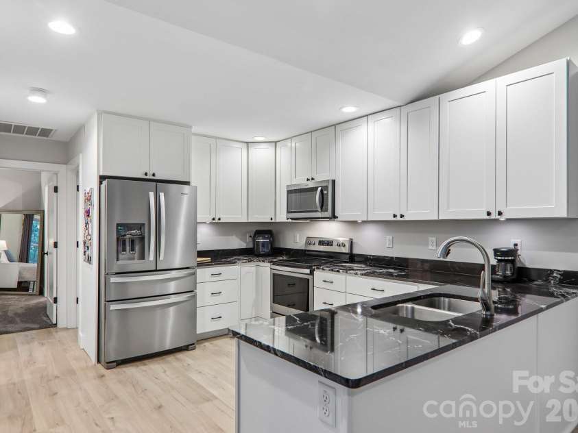 49 Wilderness Trail, Candler, NC 28715.  MLS# CAR4391801, YatesRealty ID 29657. Spacious kitchen