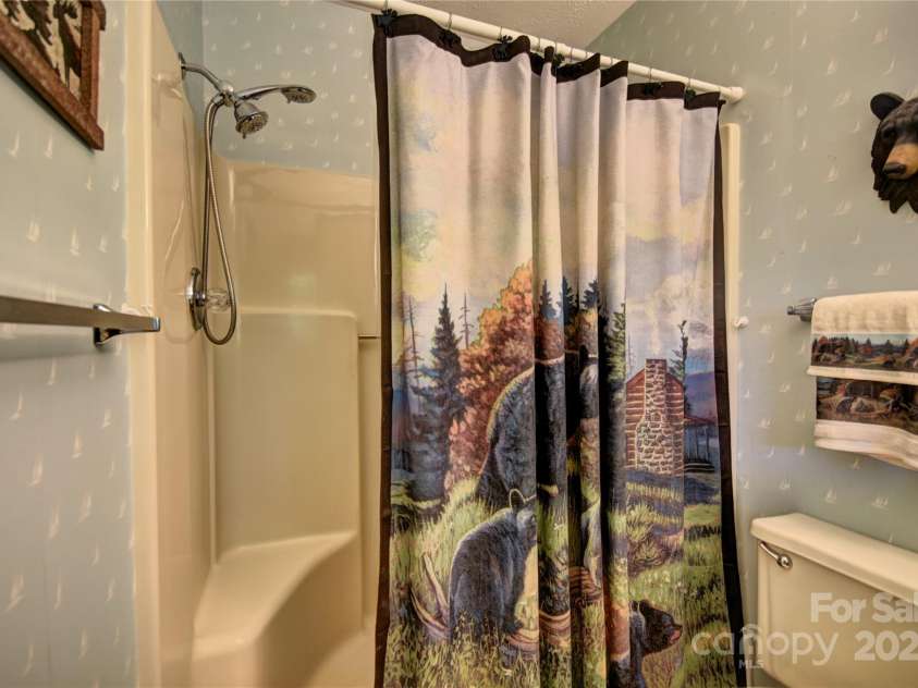 134 Raven Ridge, Maggie Valley, NC 28751.  MLS# CAR4249162, YatesRealty ID 29662. Shower in the primary bathroom