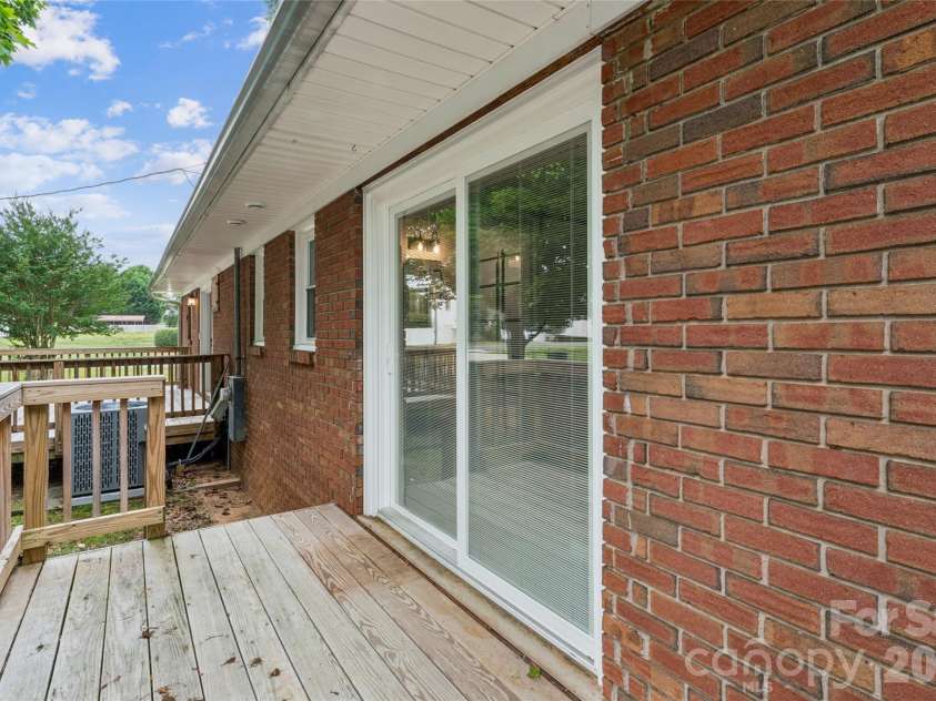 615 5th Street, Landis, NC 28088.  MLS# CAR4386679, YatesRealty ID 29662. Deck off primary bedroom