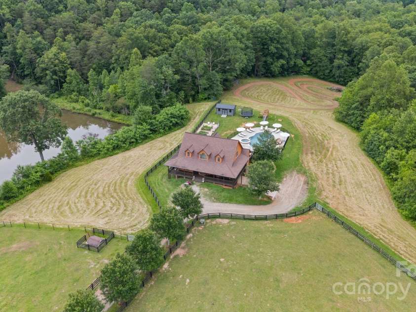 6500 Duck Creek Road, Lenoir, NC 28645.  MLS# CAR4258790, YatesRealty ID 29667. Areal with pond on left 