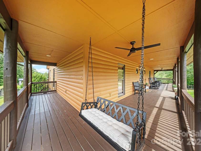 6500 Duck Creek Road, Lenoir, NC 28645.  MLS# CAR4258790, YatesRealty ID 29667. Front porch wraps 3 sides of the house 