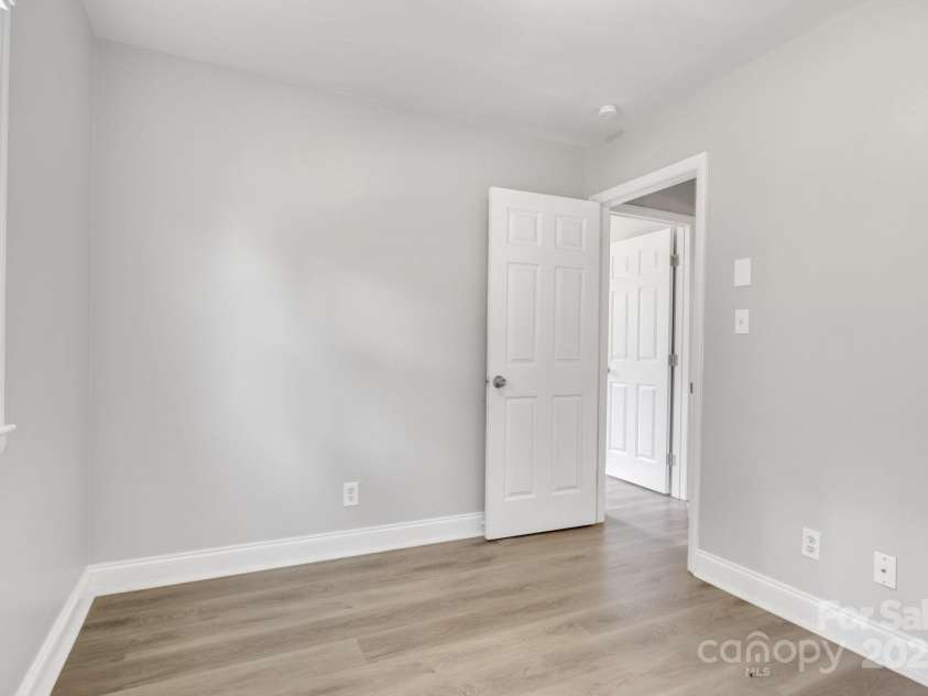 609 Bilmark Avenue, Charlotte, NC 28213.  MLS# CAR4276678, YatesRealty ID 29671. Second shot of first bedroom, facing entry door.