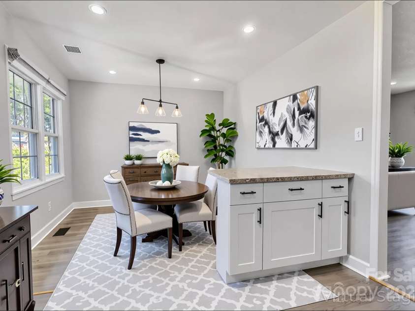 609 Bilmark Avenue, Charlotte, NC 28213.  MLS# CAR4276678, YatesRealty ID 29671. Shot of dining area while standing in kitchen, immediately walking in from living room (virtually staged). Back is to kitchen.
