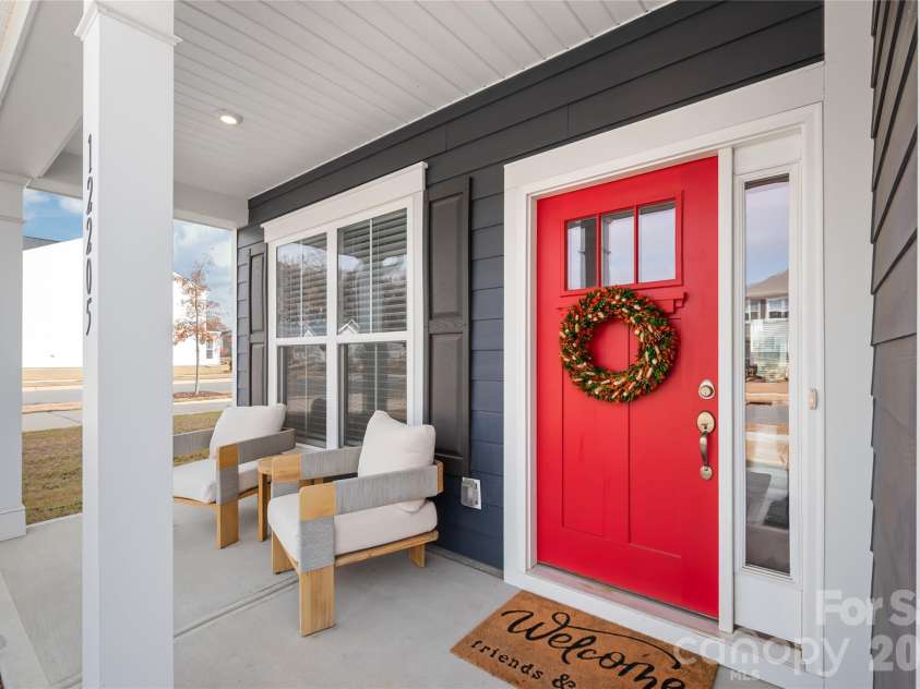 12205 Hollinhope Drive, Charlotte, NC 28278.  MLS# CAR4385321, YatesRealty ID 29673. Covered Rocking Chair Front Porch Welcomes You