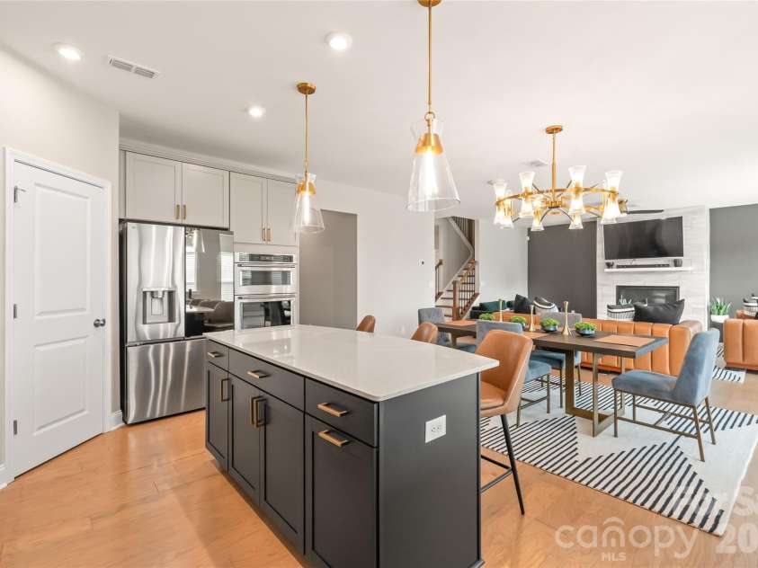 12205 Hollinhope Drive, Charlotte, NC 28278.  MLS# CAR4385321, YatesRealty ID 29673. The kitchen, dining area, and living room flow together so everyone can be together