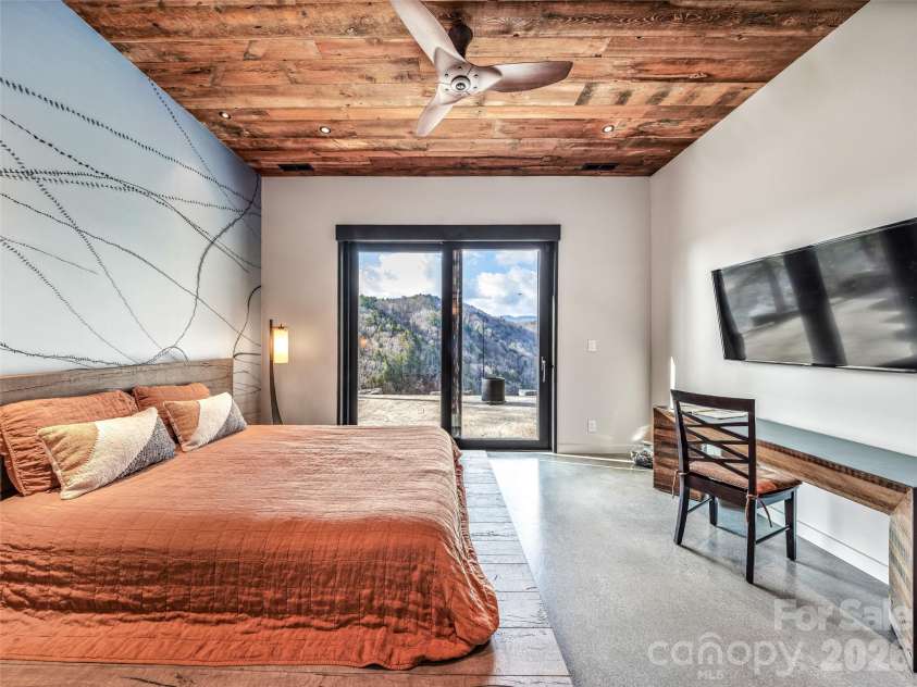 112 Moon Shadow Lane, Marshall, NC 28753.  MLS# CAR4332984, YatesRealty ID 2969. Bedroom opening up to the lower level patio.